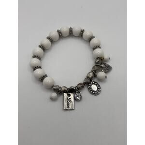 Silver toned charm white bead stretch bracelet “love”